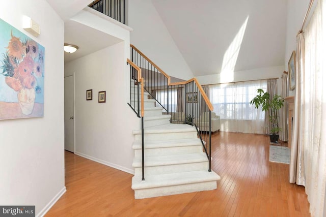 stairs with hardwood / wood-style floors