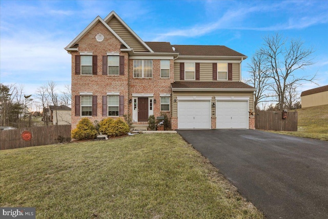 view of front of house with a garage and a front yard