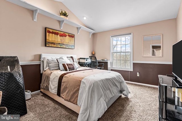 carpeted bedroom with lofted ceiling