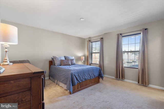 bedroom featuring light colored carpet