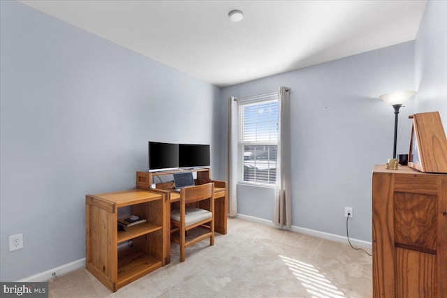 office area featuring light colored carpet