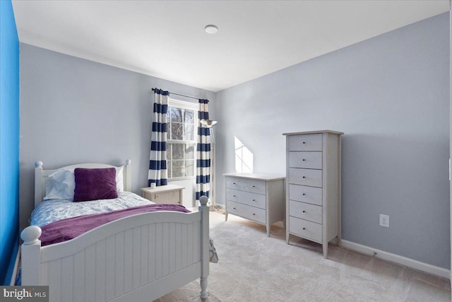 bedroom with light colored carpet