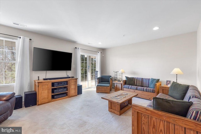 carpeted living room with french doors