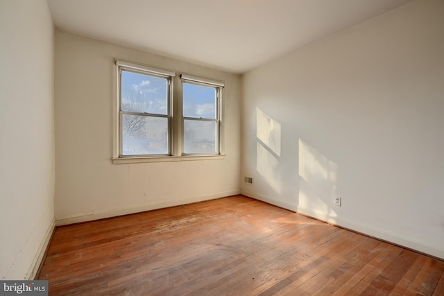 spare room with light hardwood / wood-style flooring