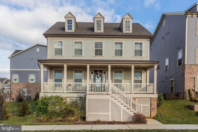 view of front of home featuring a porch and a front yard