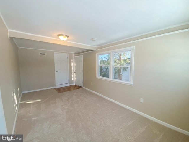 empty room featuring light colored carpet