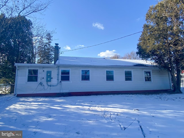 view of snow covered house