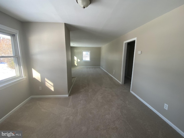 hallway featuring dark carpet