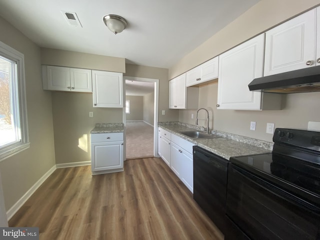 kitchen featuring white cabinetry, sink, black appliances, and light stone countertops