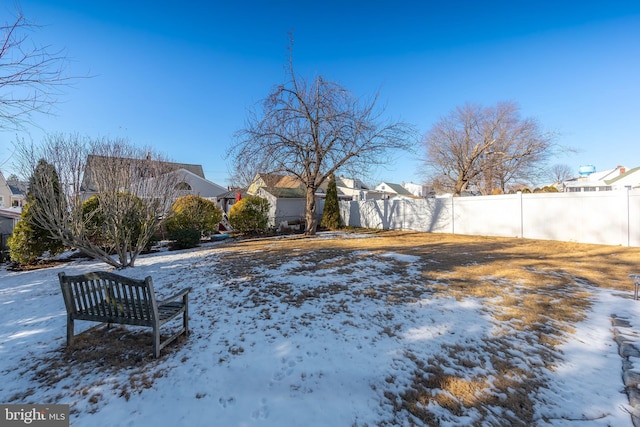 view of yard covered in snow