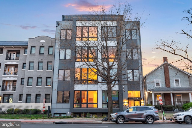 view of outdoor building at dusk