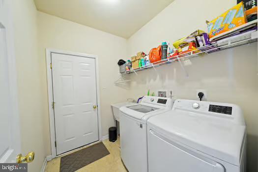 laundry room with separate washer and dryer