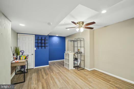 interior space with hardwood / wood-style flooring and ceiling fan