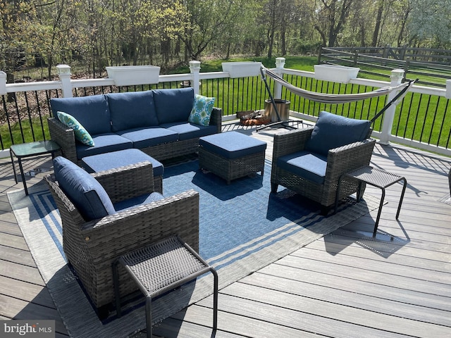 deck with a yard and outdoor lounge area