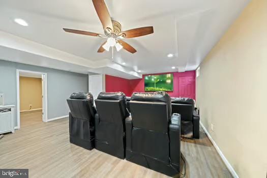 cinema featuring light hardwood / wood-style floors