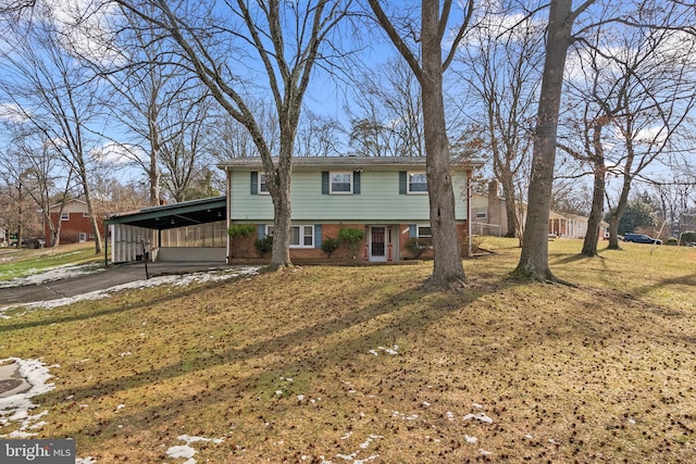 view of front of house with a carport and a front lawn