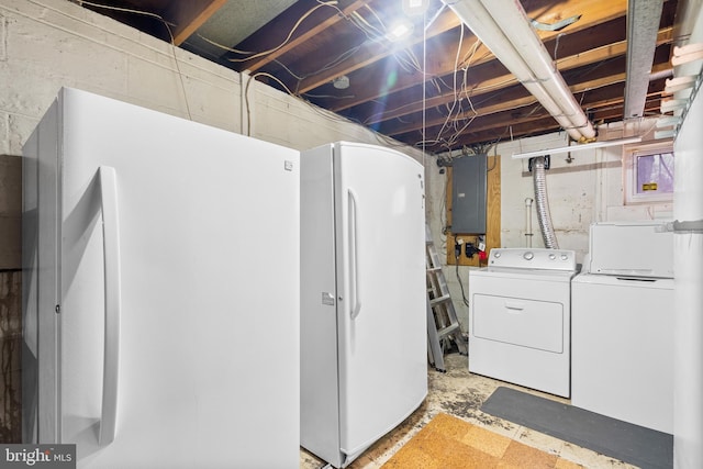 washroom with electric panel and independent washer and dryer