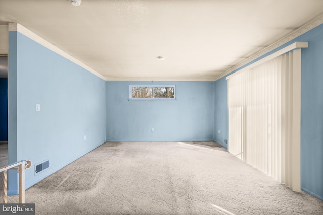 empty room featuring light colored carpet