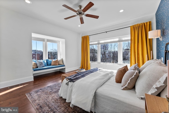 bedroom featuring ceiling fan and dark hardwood / wood-style floors