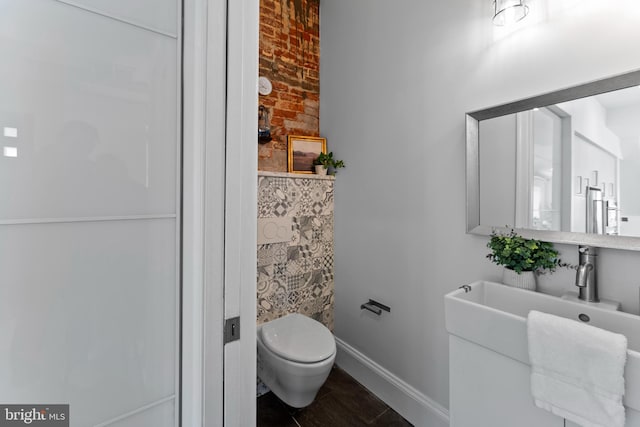 bathroom with toilet and sink