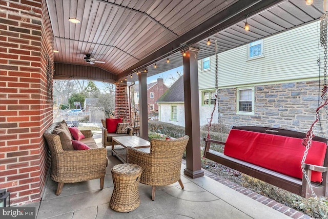 view of patio / terrace with ceiling fan and an outdoor hangout area