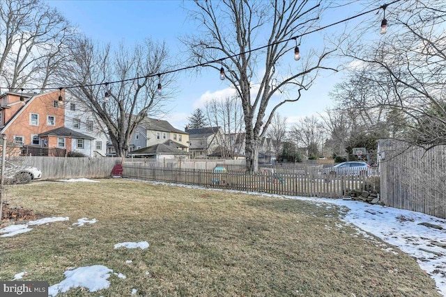 view of yard layered in snow