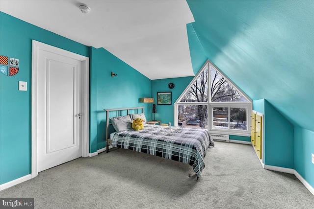 carpeted bedroom featuring vaulted ceiling