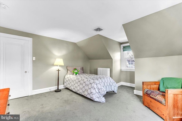 carpeted bedroom with lofted ceiling and radiator heating unit