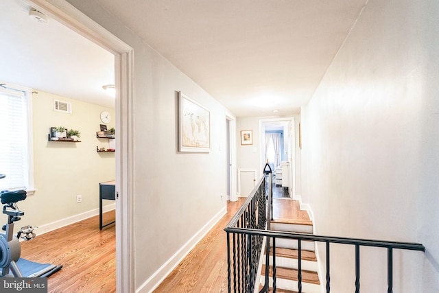 hall with light hardwood / wood-style floors