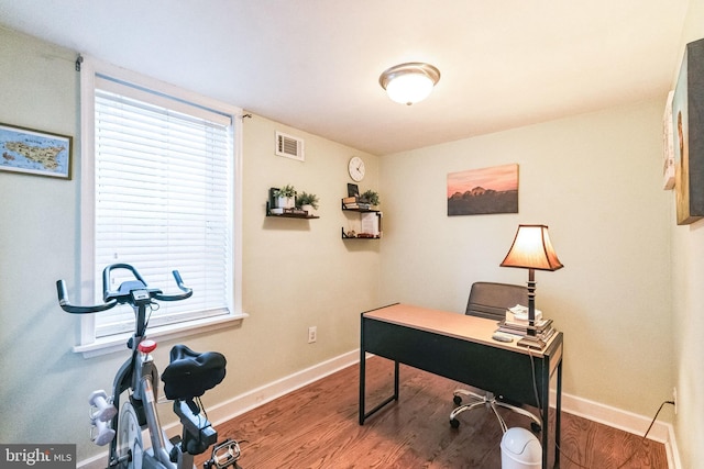 office with hardwood / wood-style flooring