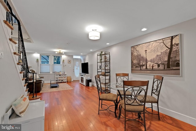 dining area with hardwood / wood-style floors