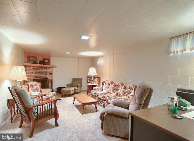 living room featuring carpet floors and a brick fireplace