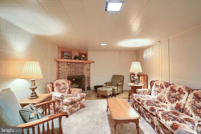 living room featuring a brick fireplace