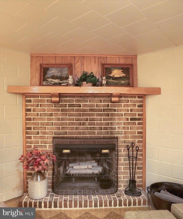 room details featuring a brick fireplace