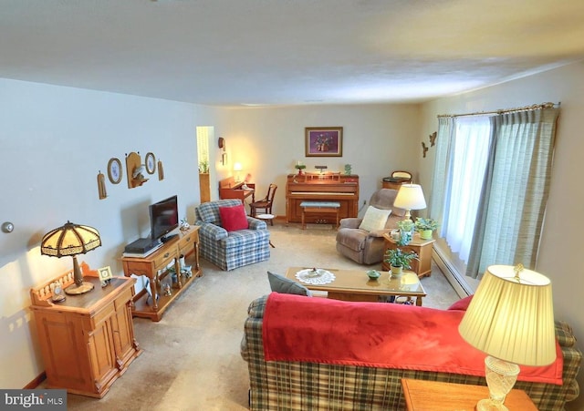 living room with light carpet and a baseboard heating unit