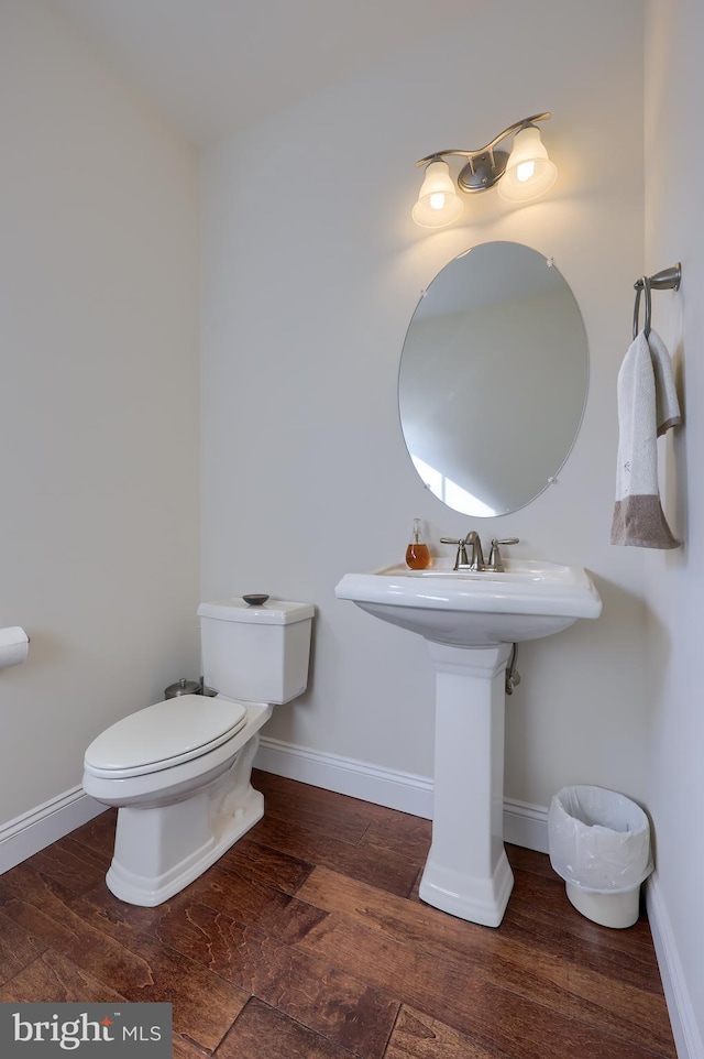 bathroom featuring toilet and hardwood / wood-style floors