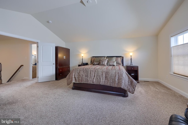 bedroom with light carpet and high vaulted ceiling