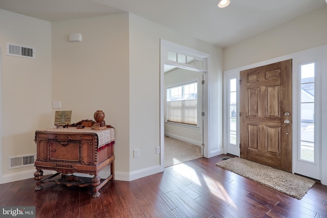 entryway with dark wood-type flooring