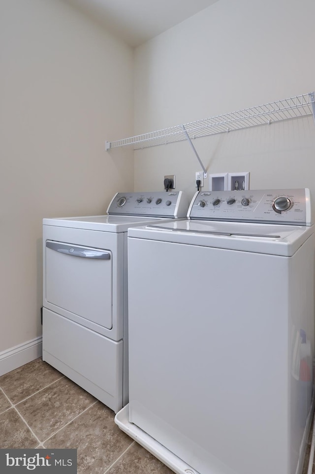 clothes washing area featuring washing machine and clothes dryer