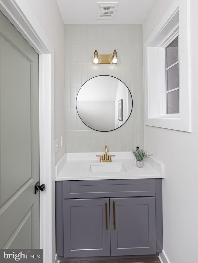 bathroom with vanity and visible vents