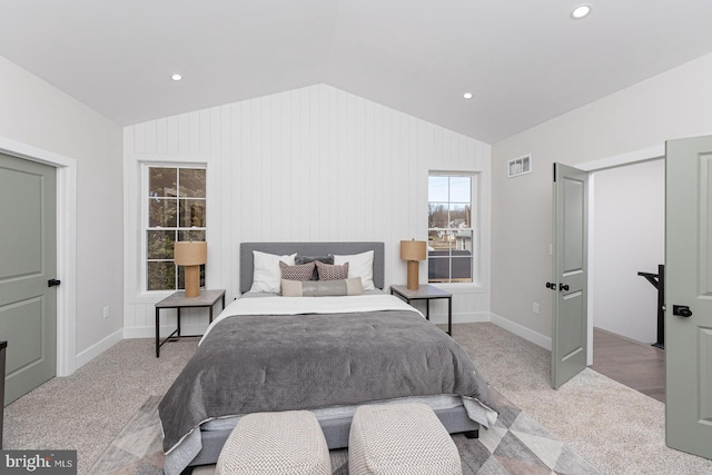 carpeted bedroom featuring lofted ceiling, visible vents, baseboards, and recessed lighting