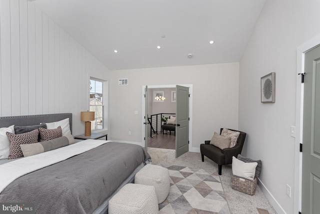 bedroom featuring lofted ceiling, visible vents, baseboards, and recessed lighting