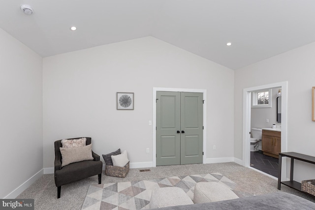 sitting room with vaulted ceiling, carpet, and baseboards