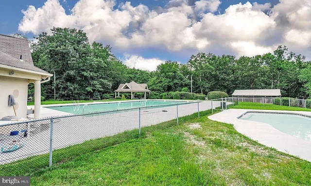 view of pool with a gazebo and a lawn