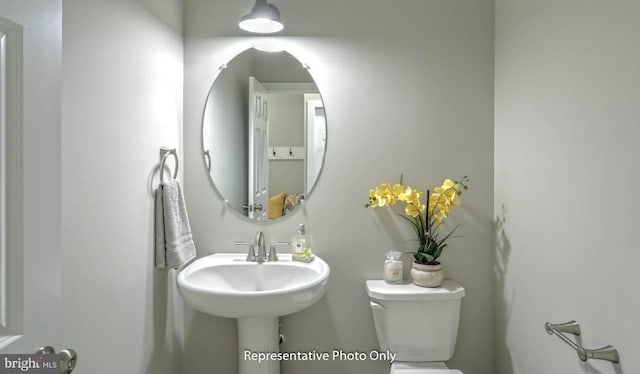 bathroom featuring toilet