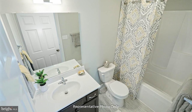 full bathroom featuring vanity, toilet, and shower / tub combo with curtain