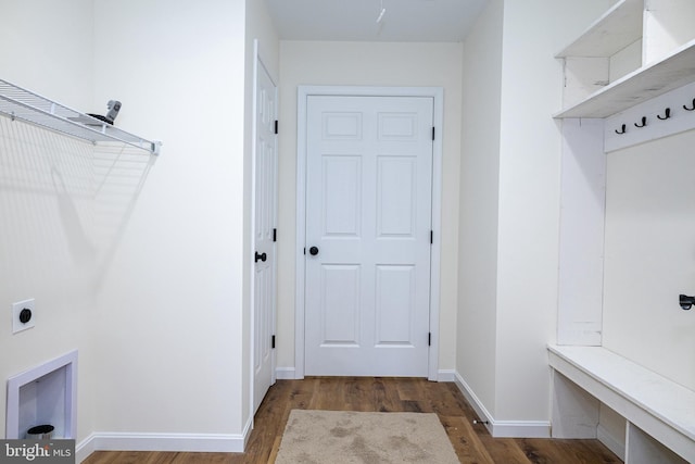 laundry area featuring electric dryer hookup and dark hardwood / wood-style floors