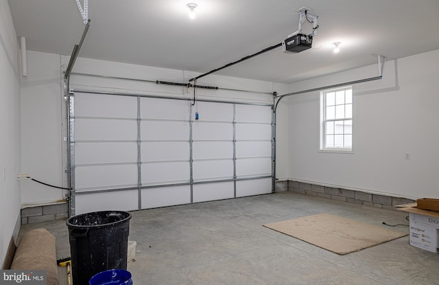 garage featuring a garage door opener