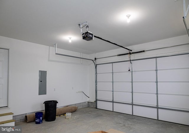 garage featuring a garage door opener and electric panel