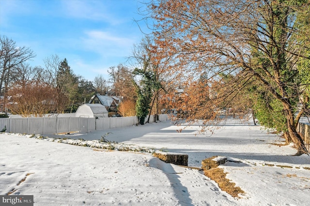 view of yard layered in snow